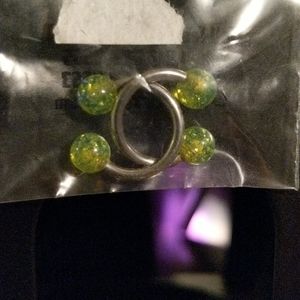Two 14g horse shoes w/ 4 glittery green balls